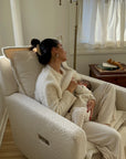 Flynn – Gliding Swivel Nursery Recliner - High Performance Bouclé Oyster